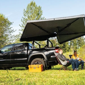A large Yakima shade tent extending from the back of a pickup truck