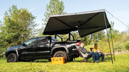A large Yakima shade tent extending from the back of a pickup truck