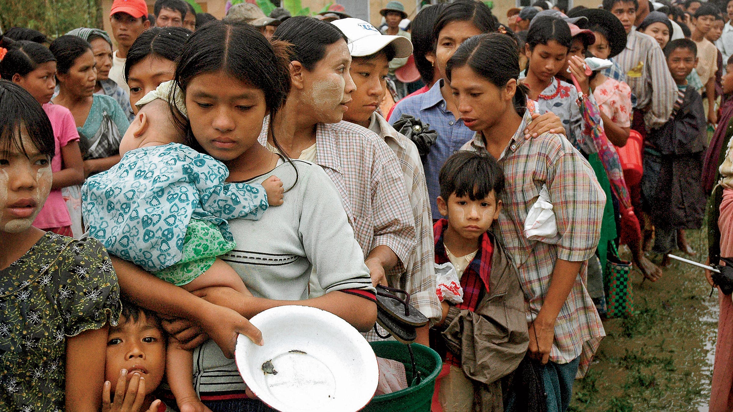 Survivors of Cyclone Nargis line up for relief supplies in Bogalay, May 13, 2008.