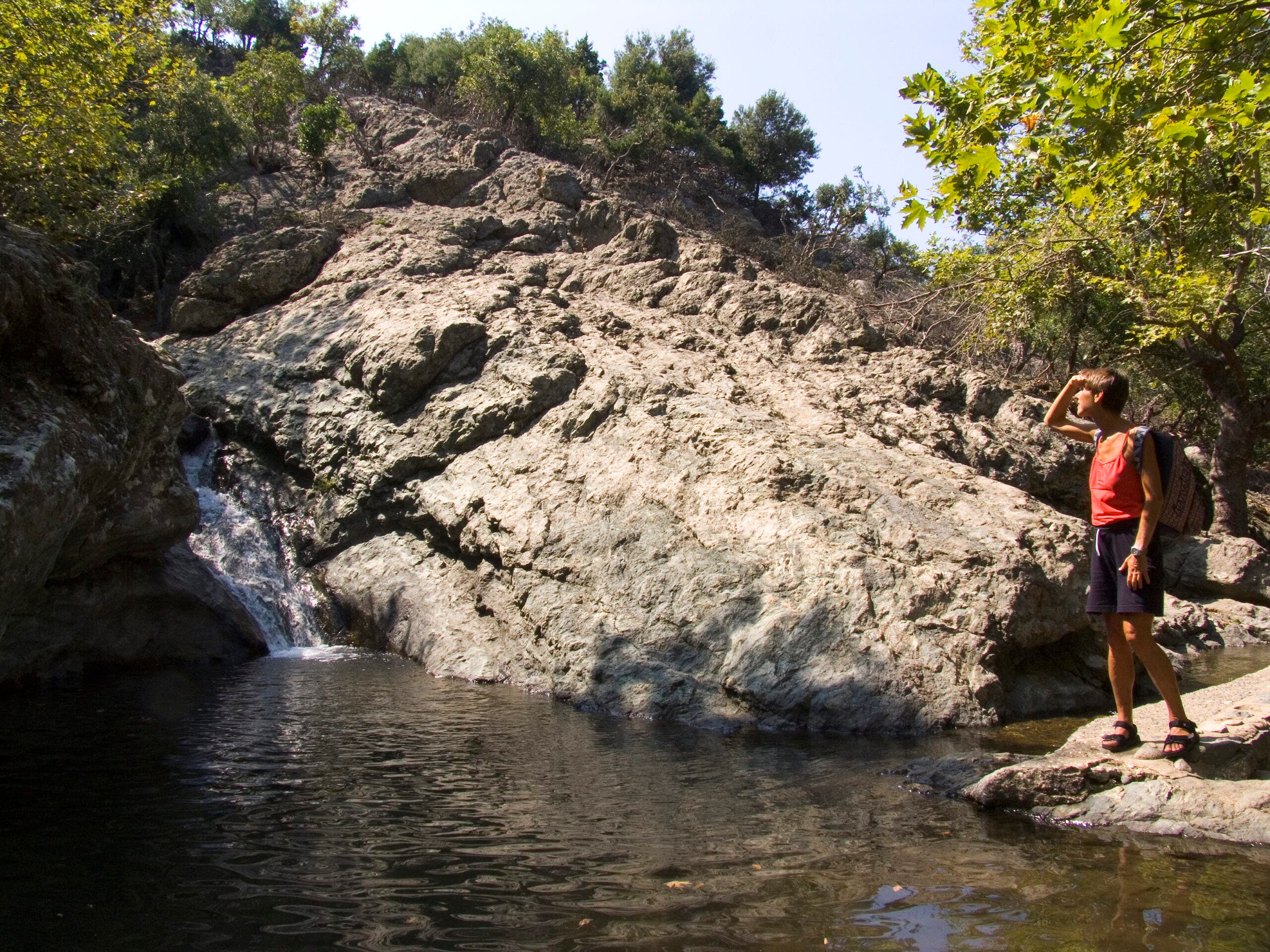 a waterfall in a forested area of Samothraki Island in Greece