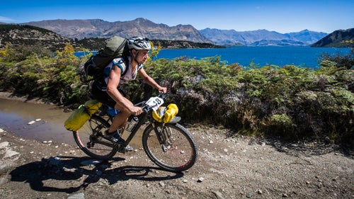 Angus Watson from New Zealand-based Team SAS (Still Accepting Sponsors) still smiling on the last section of the mountain bike course before heading out on the final paddle around Lake Wanaka and the finish line. They unfortunately did not finish.