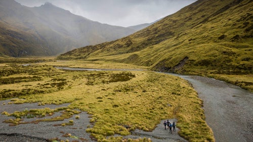 A team navigating its way along the valley toward the Albert Burn Saddle.