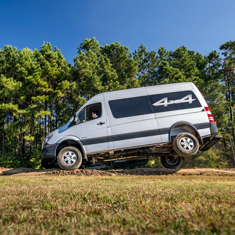 Mercedes-Benz uses electronics instead of mechanical locking differentials to get power to the wheels with traction. This essentially cuts power to wheels that are off the ground and directs it to the ones that are still on terra firma.