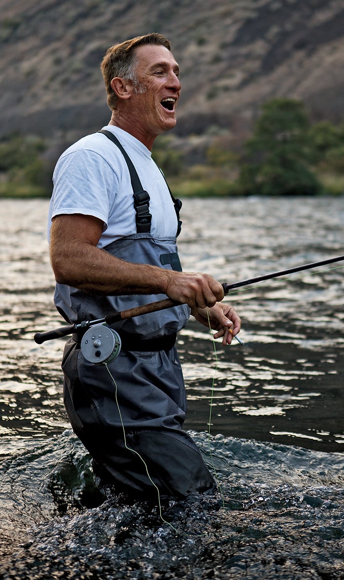 Joe laughs as a steelhead slips off his line. Steelhead are rainbow trout that begin in freshwater, spend many years in the ocean, then return to their native rivers to spawn. They grow bigger, fight harder, and shine a brighter silver than rainbow trout that never leave freshwater.