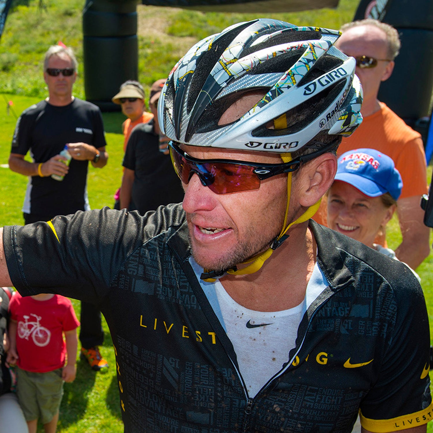 Amid growing controversy over his surrendering to the allegations of doping by the U.S. Anti-Doping Agency, Lance Armstrong gives first place winner Keegan Swirbul, 16 of Aspen, a pat on the chest after coming in second place to him in the Power of Four mountain bicycle race Saturday morning in Aspen Colorado.