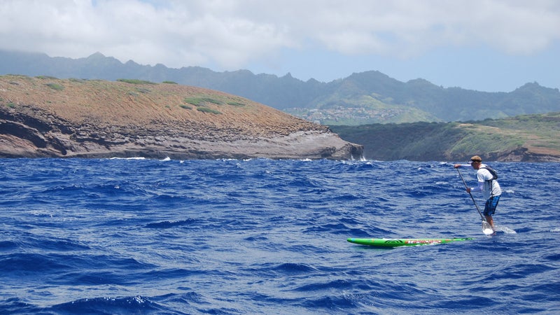 2014 Men's SUP Champion Connor Baxter rounds China Wall near Honolulu on his way to a new course record and third victory.