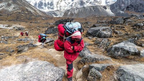 A Sherpa gets paid about $32.50 per round trip to carry heavy loads through the dangerous Khumbu Icefall.