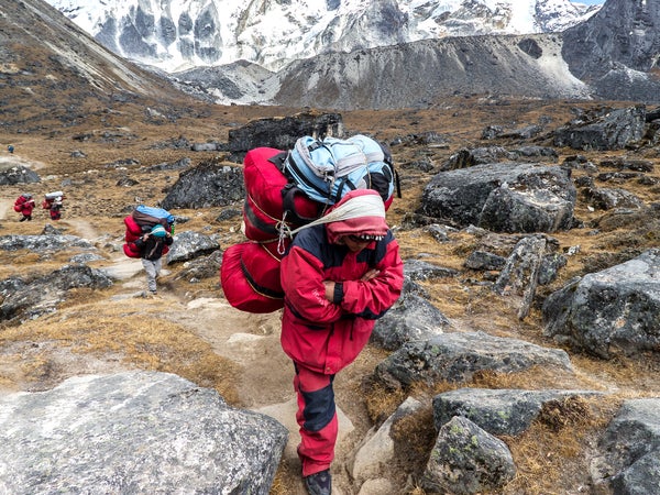 A Sherpa gets paid about $32.50 per round trip to carry heavy loads through the dangerous Khumbu Icefall.
