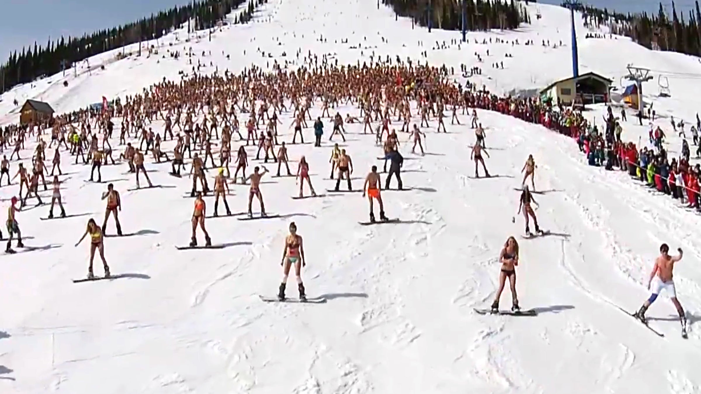 The almost 2,000 skiers and snowboarders set a record for largest downhill ride in swimsuits.