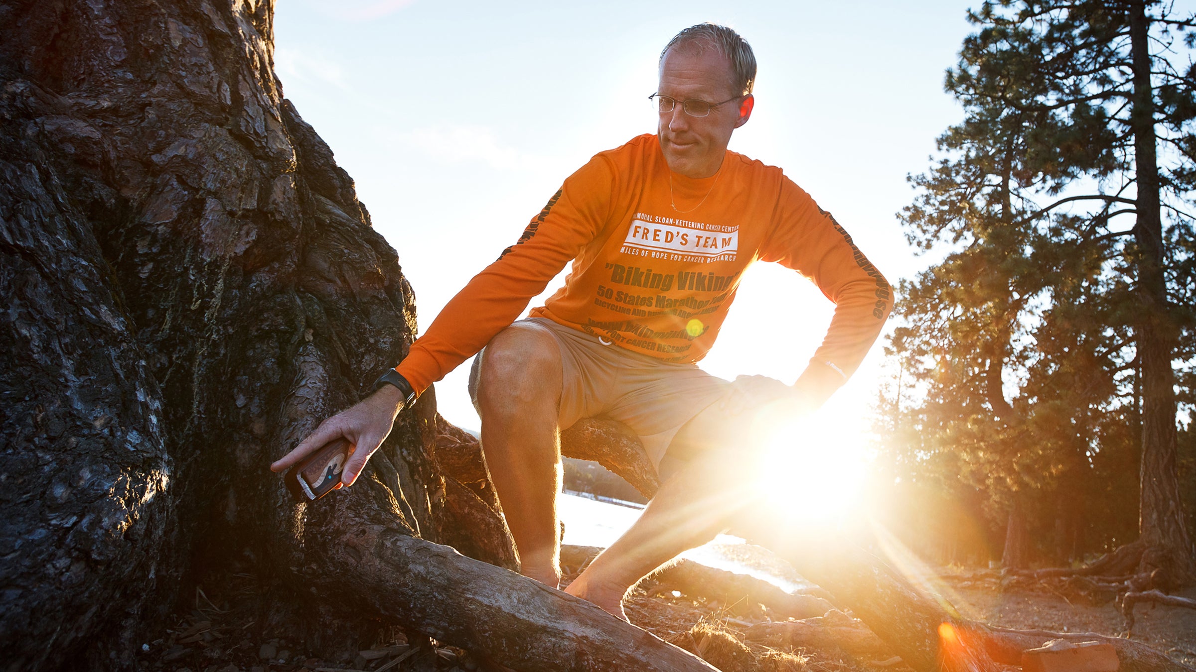 Anders Forselius scatters the ashes of Alex Blackburn on the beach near the Fort Grounds in Coeur d'Alene, Idaho.  