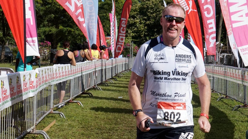 Anders crossing the 2014 Jamaica Marathon finish line.