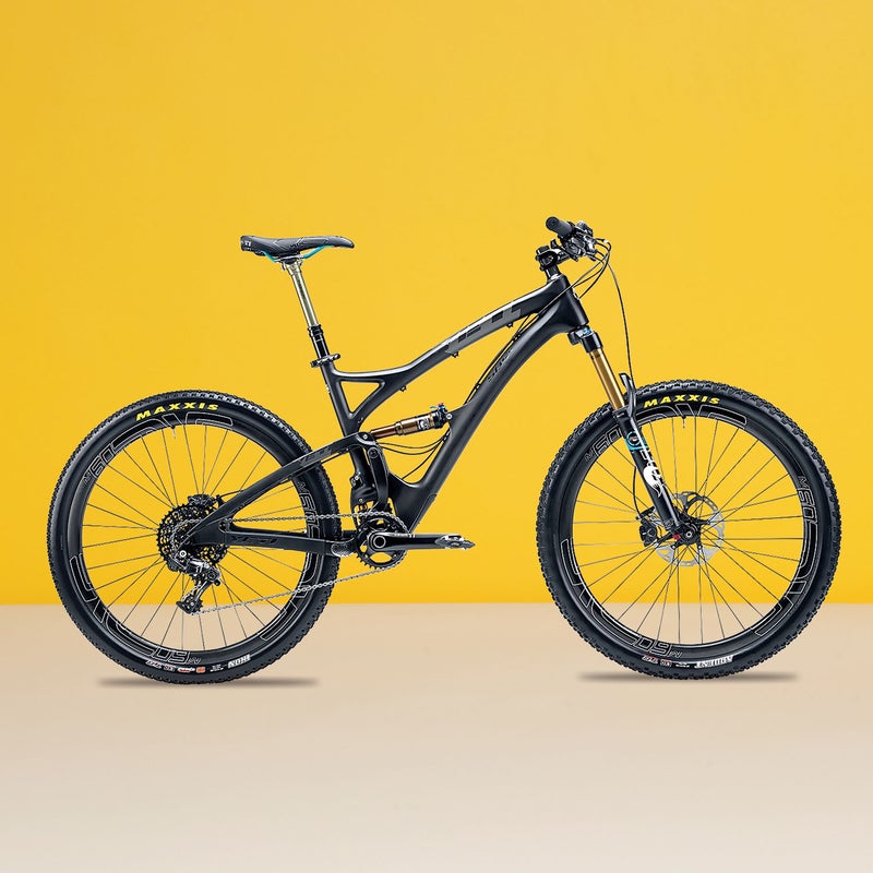Best For: Your one-bike quiver. The Test: Yeti’s Switch Infinity suspension gets the award for most interesting design, with a link that changes direction partway through the travel, providing excellent small-bump handling and plush, solid support on big hits. “Mechanics aside, it’s the smoothest suspension I’ve ever felt,” said one tester. The front end of the five-inch SB5C ($9,349) is slack and the bottom bracket low, making this 27.5er more capable on descents than the slightly longer-travel Ghost. And Enve’s M60 Forty wheels are so stiff and confident, you’ll want to bomb downhill on them. The Verdict: A trail bike for riders with big-hit dreams. 26.2 lbs; yeticycles.comClimbing: 4.5Descending: 4