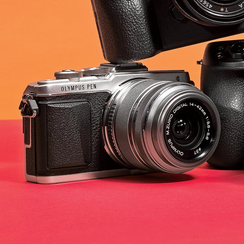 Best For: Replacing your current adventure camera.  
The Test: Want the advantage of dozens of lens options minus the weight, bulk, and cost? Get this ($600). It absolutely crushed a test shoot during a Colorado ski tour; the 16-megapixel sensor didn’t pixelate highlights even in white-room blowing snow. And at a mere 19.5 ounces with a 14–42mm zoom lens, it was easy to use one-handed. The smartphone-style controls are brilliant, and the battery tolerated temperatures near zero.  
The Verdict: “My new favorite travel camera,” concluded one tester. getolympus.com  
Utility: 5 
Tech: 4