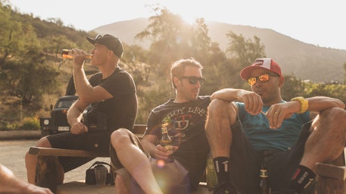 The calm before the storm. On the eve of the race, Gary Perkin, Jon Cancelier, and Felipe Vasquez take one last opportunity to relax and share a few beers with friends. Having participated in the event the year before, they know the challenges they lie ahead.
