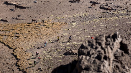 Racers navigate what looks like the surface of Mars to reach the top of stage one, where the only spectators were a few wild horses. This same route is also used by many backpackers hiking to the top of nearby Cerro Plomo.
