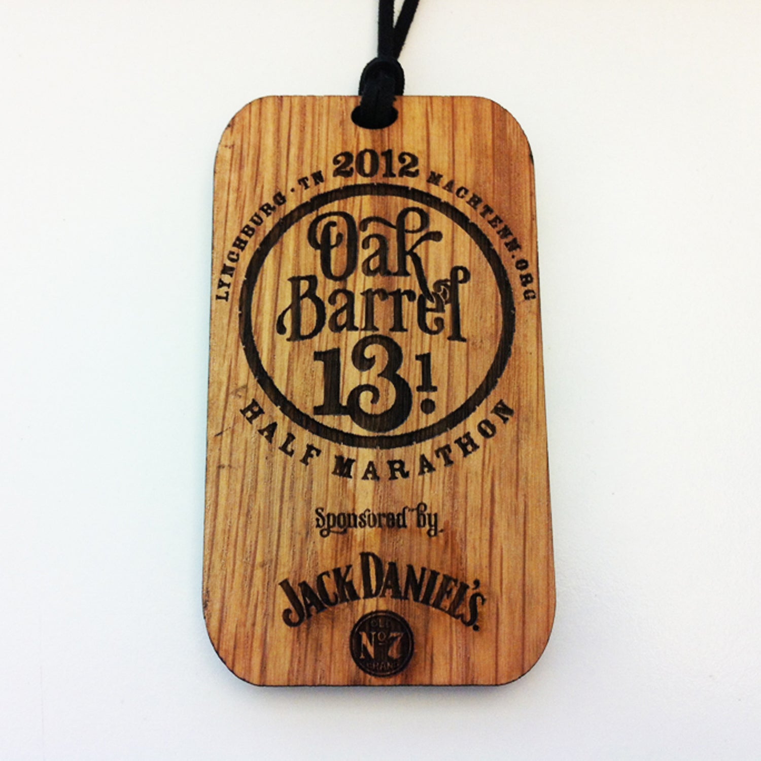Solera: With so many medals made of its homonym, it’s refreshing to see one made of wood. Sponsored by Jack Daniels, this event gives each finisher a medal that looks as if it were dipped and aged in whiskey. Burnt edges and a leather strap give this memento a lot of Southern charm and character. In keeping with the theme, age group winners received a wedge of a whiskey barrel.