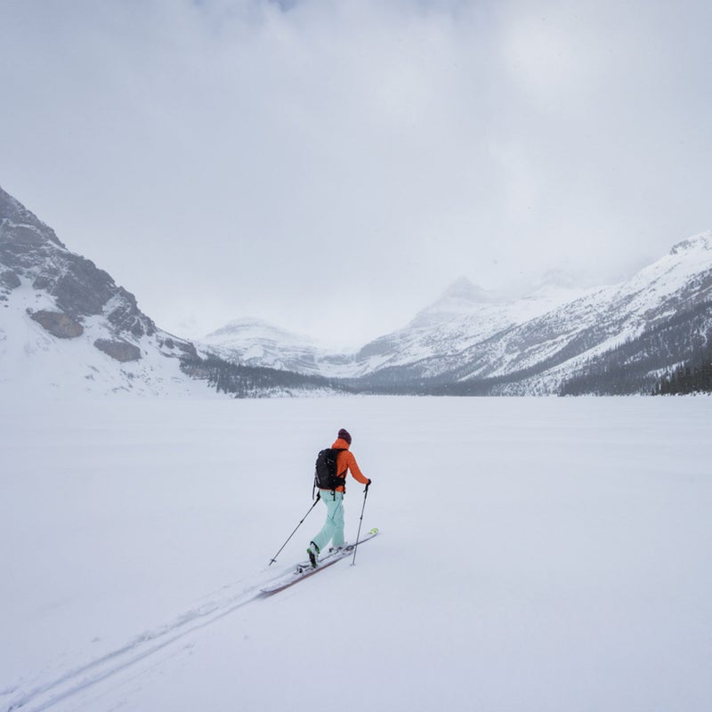 Utah-based skier Kalen Thorien lays a track across a frozen Bow Lake, one of dozens of lakes that line the famous Icefields Parkway in Banff National Park.