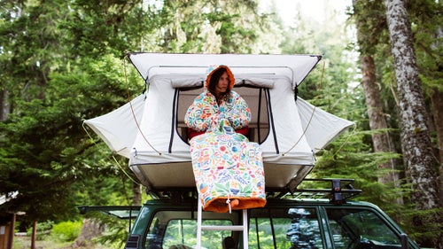 The vehicle-rooftop tent designed by Portland鈥檚 Poler Stuff folds open to create a space large enough for a queen-sized foam mattress. Formed from heavy-duty canvas, aluminum poles, and a ladder, the tent attaches to Thule or Yakima bars, and thus can be placed on nearly any vehicle.