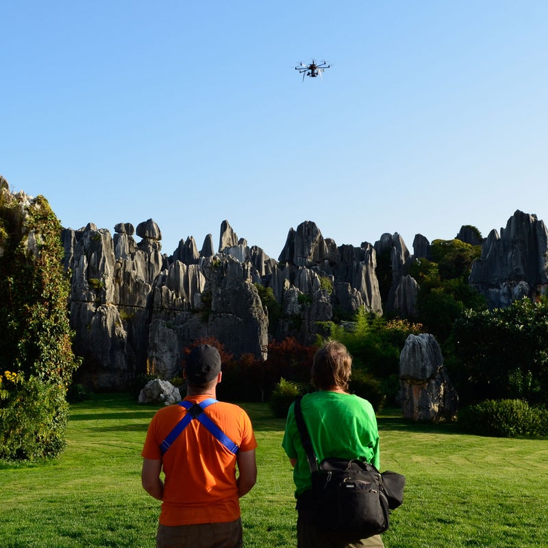 Professional photographer Chad Copeland traveled to some of the most remote areas in China to shoot pro climbers Emily Harrington, Matt Segal, and Cedar Wright for National Geographic. To capture some of the more difficult shots, he took along a 15-pound carbon fiber FreeFly Systems Cinestar Octocopter drone. Turns out that shooting from the air pays off in spectacular imagery.