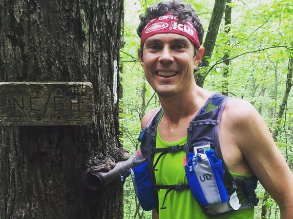 Scott Jurek stands at the border of Georgia and North Carolina on the Appalachian Trail.