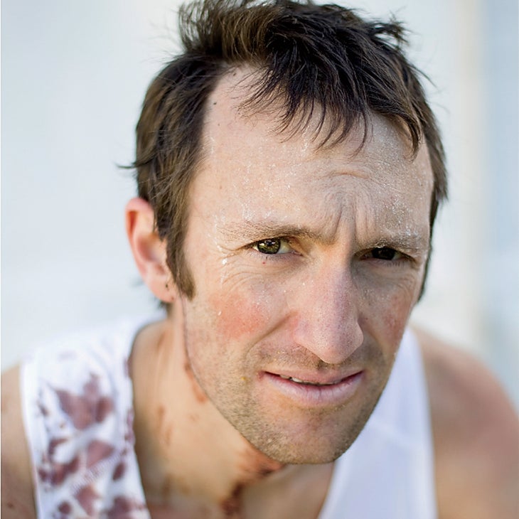 Closeup of Mike Wolfe, who suffers from overtraining syndrome, covered in dried sweat