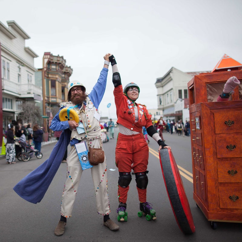 A popular saying among racers: “For the glory!” Two members of the Kinetic Paranormal Society celebrate at the finish line. Rather than build a sculpture, this team dragged an armoire along the 40-mile course. Glorious indeed.