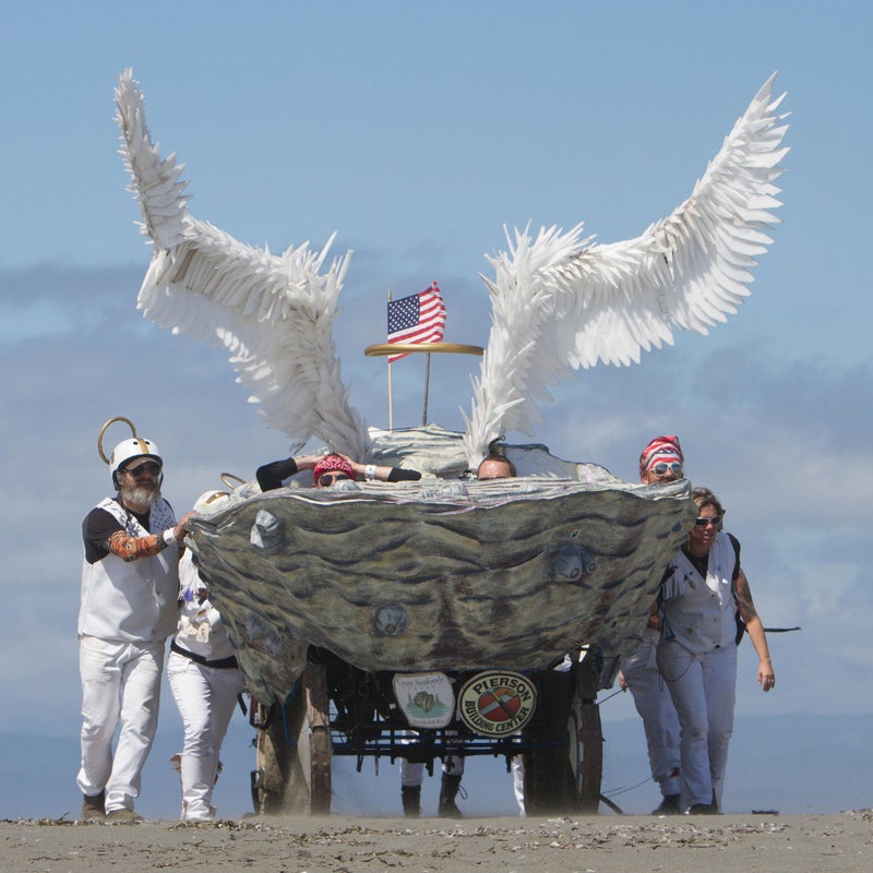 Founded by artist Hobart Brown in 1969, the Kinetic Grand Championship is now a Northern California institution. Once racers leave the Arcata Plaza, they head for the Samoa Dunes. Teams often switch or alter their wheels to ride on top of the soft sand. Here, Shell’s Angels, an oyster-shaped two-man craft, cruises along the beach, flanked by its pit crew.