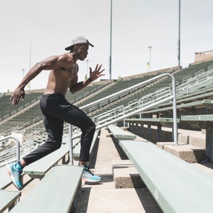 Training at the camp including running stairs and trails, completing agility drills, and doing interval runs on the track.