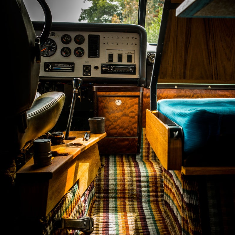 The teak side console has been carved out to accommodate my camera, lenses, pens, spare change, and coffee cups. The five-speed stick shift and powerful turbo allows for very sporty driving, but while the top speed supposedly is 100 mph, I’ve never taken it past 87 mph.