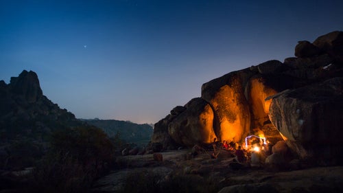 Lying on the warm rocks under the night sky while the fire warmed our toes and our friends played music.