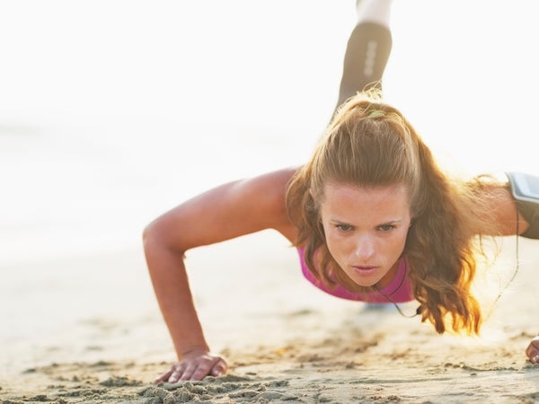 Create a packed workout on the beach by mixing strength training on land with swimming.