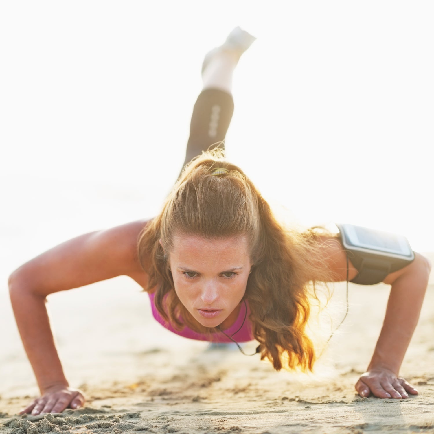 Create a packed workout on the beach by mixing strength training on land with swimming.