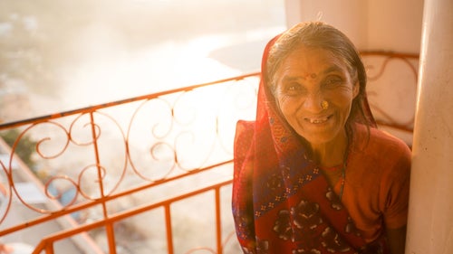 Nine floors up the Trayambakeshwar Temple in Rishikesh, I was waiting for my time-lapse while watching groups of Hindu families come and go to pray and make offerings. A large group of women rounded the corner in flurry of excitement and smiles. They gathered together and began asking for photos. Of course I took a couple shots and kept my camera handy, shooting as they left and walked down the stairs. One woman curiously trailed behind and smiled at me dearly.