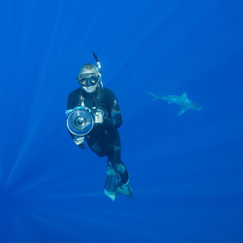 Oahu’s Juan Oliphant and Ocean Ramsey dive with sharks almost every day. Yes, it’s their job. And, yes, they have all their limbs. Dedicated researchers, Ramsey and Oliphant operate One Ocean Diving on the island’s North Shore. Through their business, they offer visitors a chance to swim—cage free—with large pelagic animals. This occupation requires a special skill set and a few indispensable pieces of gear.