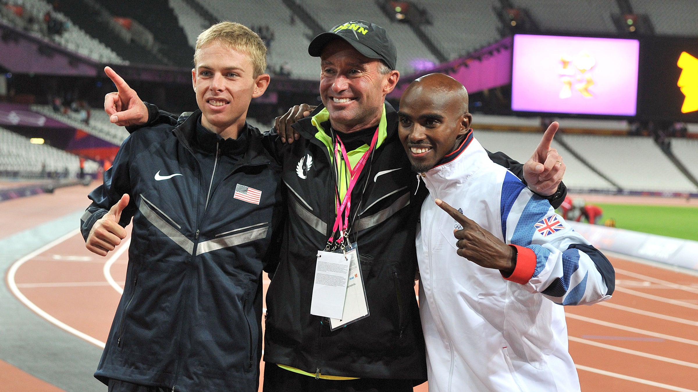 Mo Farah (right) celebrates winning the men’s 10,000-meter final with Galen Rupp (left) and coach Alberto Salazar in 2012.
