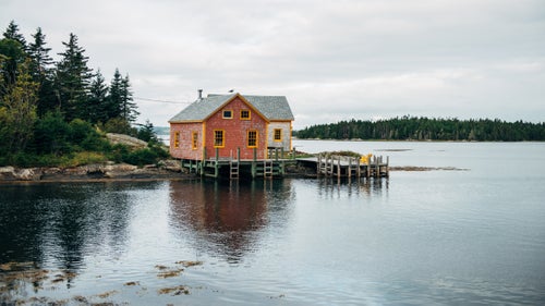 Filled with excitement one summer, we drove from Rhode Island to Nova Scotia in a day. After searching for a nonintrusive place to park and set up camp, we ended up discovering Bell Island. An elderly fisherman who was taking a walk in the neighborhood gave us permission to sleep in our truck at the end of the road. In the morning, we decided to walk around the area and took this picture of our neighbor鈥檚 house.