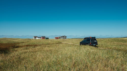 We saw these houses as little specks out on the beach as we drove north from Gros Morne National Park in Newfoundland. It didn鈥檛 look as though many people drove out that way since there was no marked road. We decided to pull off and see if we鈥檇 be able to drive out to the collection of fishing shacks. We ended up with an epic view of the houses as well as the south-facing landscape of Western Brook Pond, a landlocked fjord.