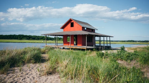 It wasn鈥檛 until we became tourists in so many other parts of the world that we really tried to look at our own home with that fresh perspective. One of our favorite discoveries is this beautiful beach shack at the tip of Grass Island in Guilford.