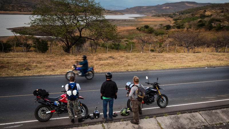 Shawyn Barylski, Jared Rosa, and Greg Chrisman overlooking a reservoir in western Nicaragua.