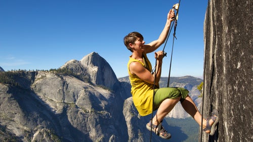 Mullin ascends to the top of Mount Watkins after a performance. While hiking with some friends the previous year, she took a 25-foot tumble, breaking her pelvis and wrist. She was all nerves during a scouting trip to a nearby mountain this spring, but on Watkins, exhilaration triumphed over fear.