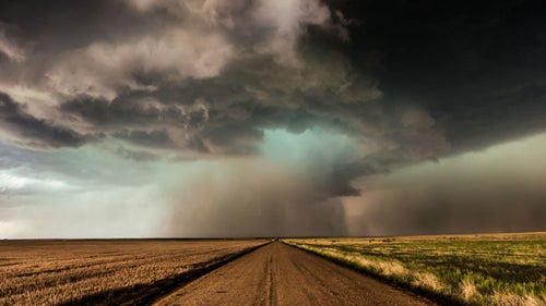 There was enough hail dropping out of this supercell that I only had enough time to expose a couple of hand-held frames.  I was mesmerized by the way it hovered right over the center of the dirt road.
