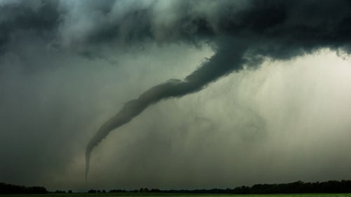 This tornado appeared suddenly over an empty field, just a few hundred yards away鈥攚e were only able to watch it for less than a minute before we had to jump back in the van and take off.