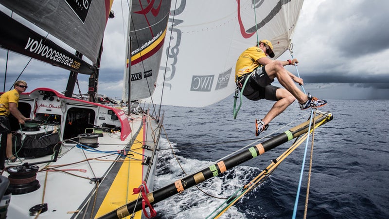 Parkinson grabs the lazy sheet off the A3 before changing sails in the Pacific Ocean en route to Auckland, New Zealand.