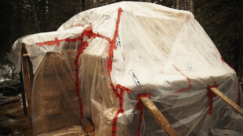 Eastbound then wrapped his temporary home in a layer of clear polyethylene plastic to waterproof the straw and prevent it from rotting away. The plastic trapped condensation, which caused the roof to sprout greens in the spring.
