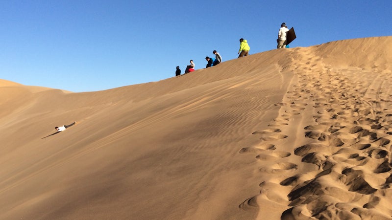 Sandboarding in Swakopmund, Namibia.