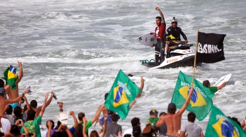Brazil's Filipe Toledo celebrates after winning the World Surf League (WSL) Rio Pro championship in Rio de Janeiro, May 2015. Fellow Brazilian surfer Gabriel Medina has expressed a wish to compete in the Olympics.
