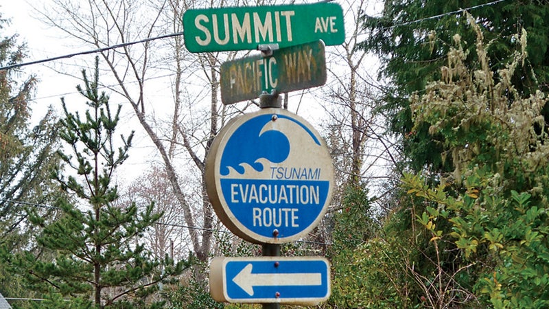 A sign in the coastal town of Seaside, Oregon, seen on March 19, 2011, shows residents the directions for higher ground in case of a tsunami.