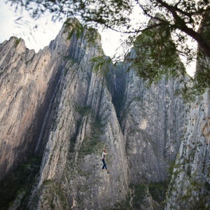 For six weeks last winter, I traveled with my friend Peter Hudnut and photographer Justin Lewis through Mexico’s Sierra Madre Oriental Mountains, a canopy of tropical and montane forests that stretches nearly one thousand miles from Monterrey to Veracruz. The mountains of Mexico are the home of the Tarahumara Indians and the site of Alex Honnold’s epic 2014 free solo on El Sendero Luminoso. But our plan was to establish highlines. We loaded enough bolts and webbing for eight new lines into the Volkswagen, and headed south across the border. 
Photo: Potrero Chico—Spanish for “little corral”—is a collection of massive limestone spires that gates the northern entrance to the Eastern Sierra Madres. Peter walked this 220-foot long highline on Christmas Day, aptly naming it Feliz Navi Highline.
