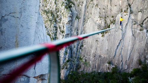 A modern highline is made from a piece of one-inch-wide flat polyester webbing, usually between 200 and 300 feet long. Taped underneath is a thin dyneema cord. Were the main line to fail, this redundancy would prevent a catastrophic fall.
Getting the line to the other side of the feature, whether it be a cave, canyon, or rock formation, is an arduous task. Often we just throw a rope as far as we can from the first anchor and bushwhack our way to the other side and climb up. Today, highliners are starting to use drones and even high-tech bows to get lines across.