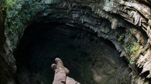 There are hundreds, if not thousands, of caves in the Sierra Madre mountain range. This one is just outside the small Huasteca village of La Laja, near Aquismon. The 300-foot-deep cave is surrounded by strong trees and has a wide, flat opening, making it a perfect candidate for a highline.